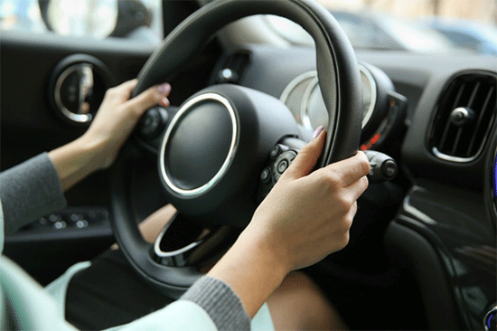 Showing the position of a driver’s hands on the steering wheel where impedance sensors are located image