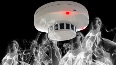 Main blog image of a smoke detector and smoke.