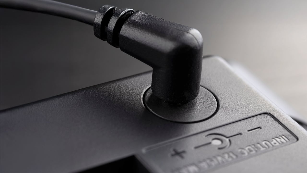 Power Adapter Inserted black 12-volt adapter plug.