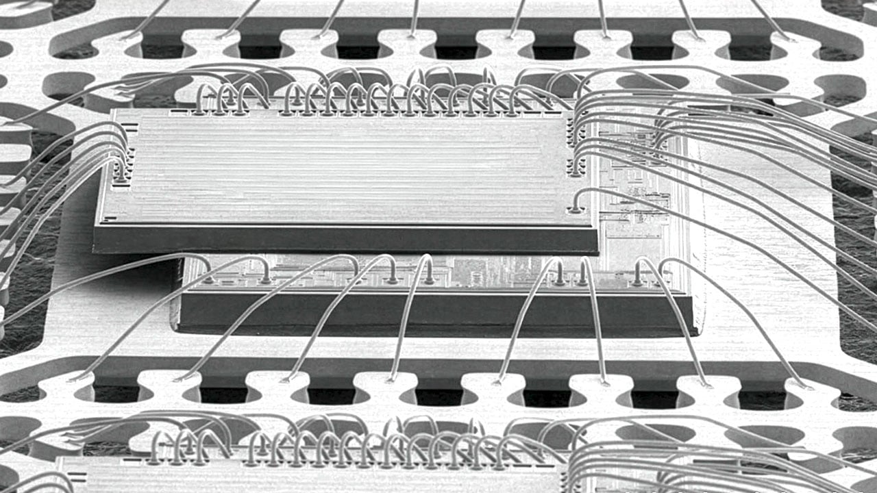 Single-Package Solution SEM‑style graphic illustrating a single‑package solution, showing a magnified, textured semiconductor package with detailed surface structure and edge features.